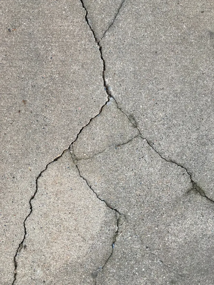 Cracked concrete slab surface showing the damage that foam injection repairs